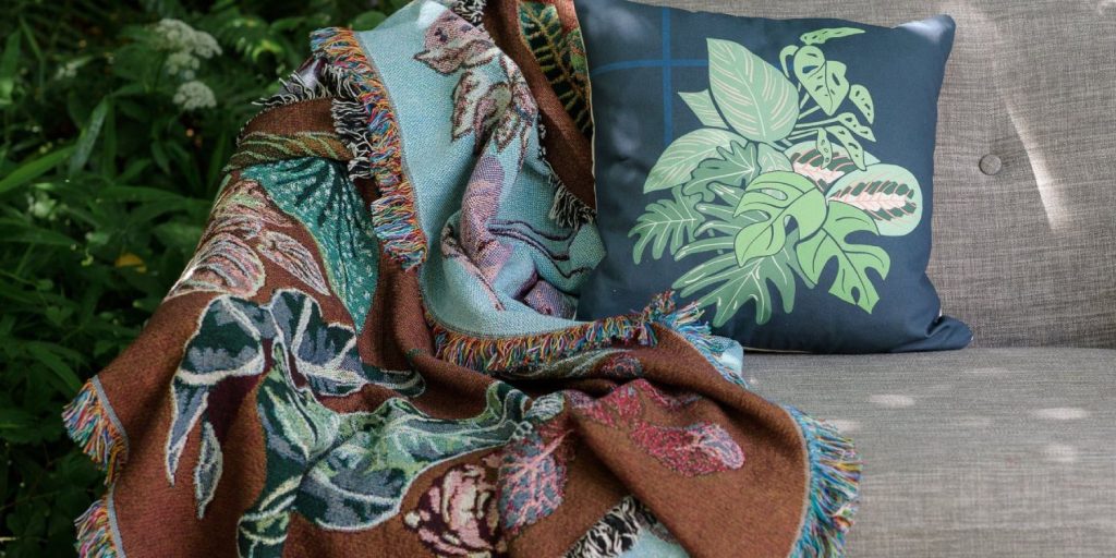 An Arcana woven throw hanging over a chair. 